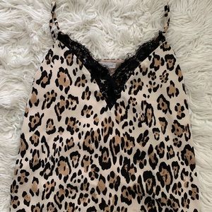 Cheetah print tank top with lace trim.